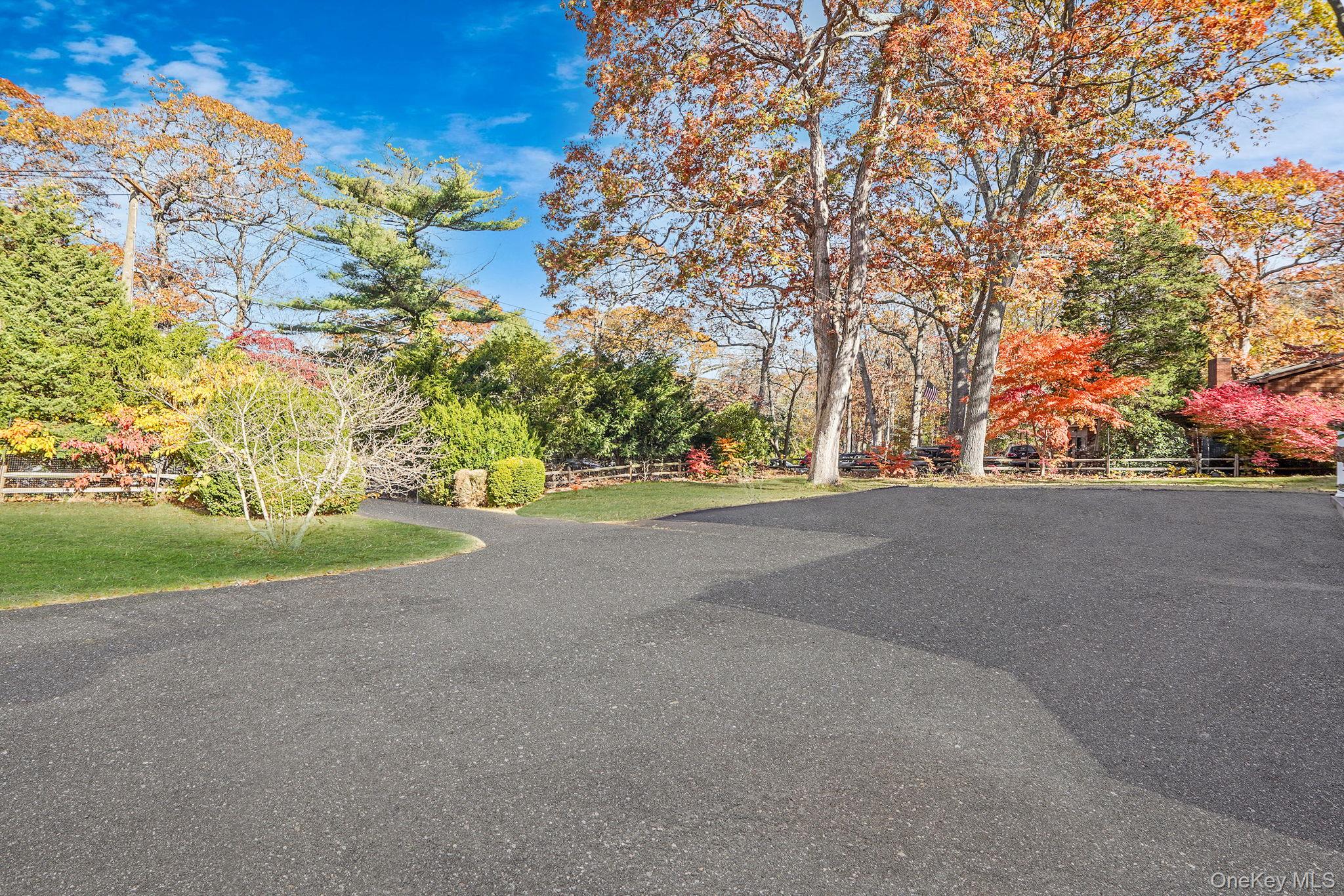 12 Harbor Beach Road Miller Place, NY 11764 - Photo 33 of 45 View of asphalt road featuring view of wooded area