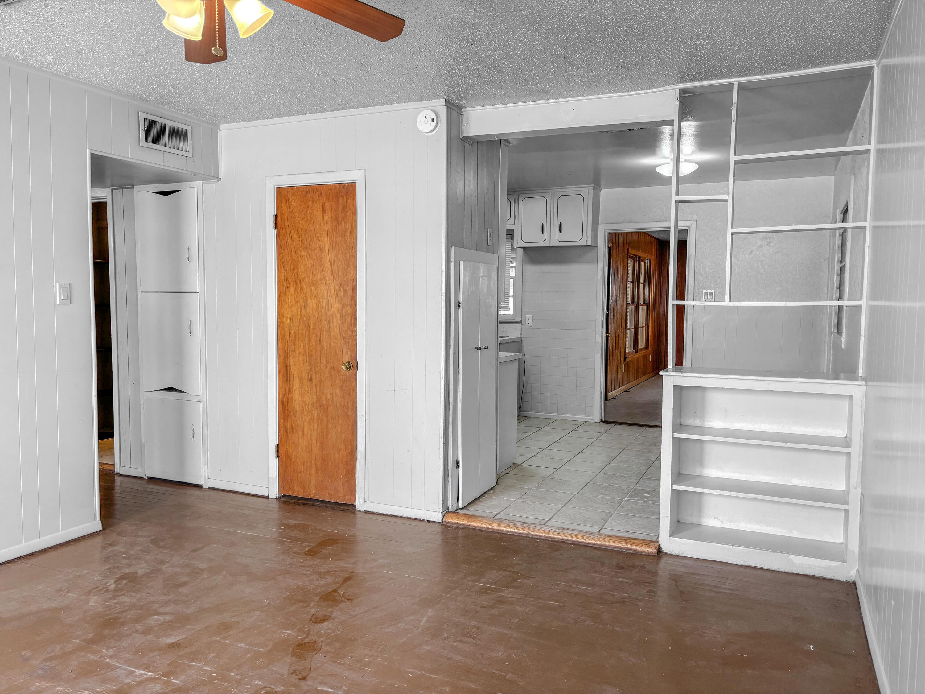 4411 45th Street Lubbock, TX 79414 - Photo 6 of 44 a view of an empty room with a bathroom