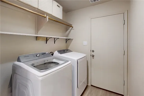 a utility room with dryer and washer