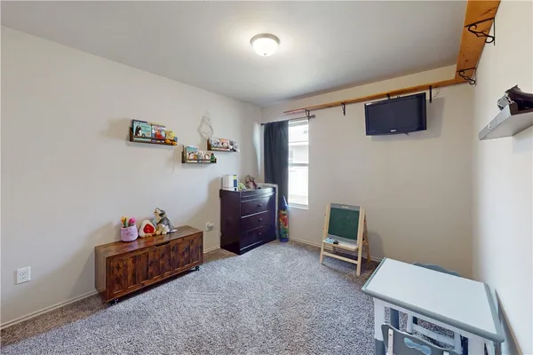 a room with furniture and a flat screen tv