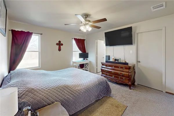 a bedroom with a bed furniture and a window