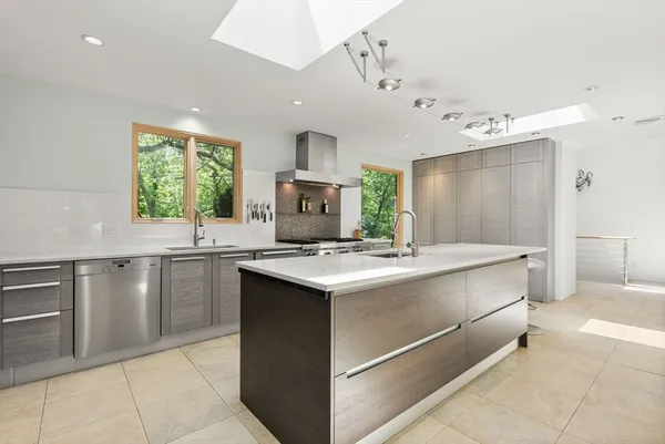 a kitchen with a stove and a sink