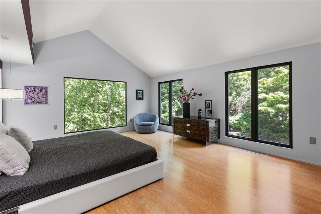 169 Hickory Road Weston, MA 02493 - Photo 16 of 30 a large bedroom with a bed and large windows