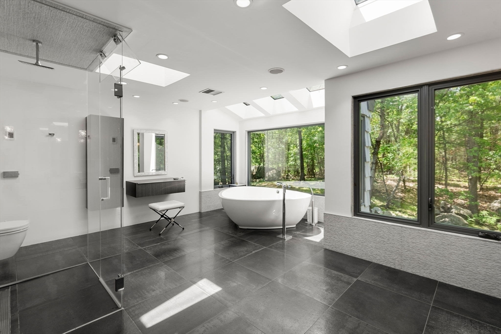 169 Hickory Road Weston, MA 02493 - Photo 18 of 30 a living room with furniture and a large window