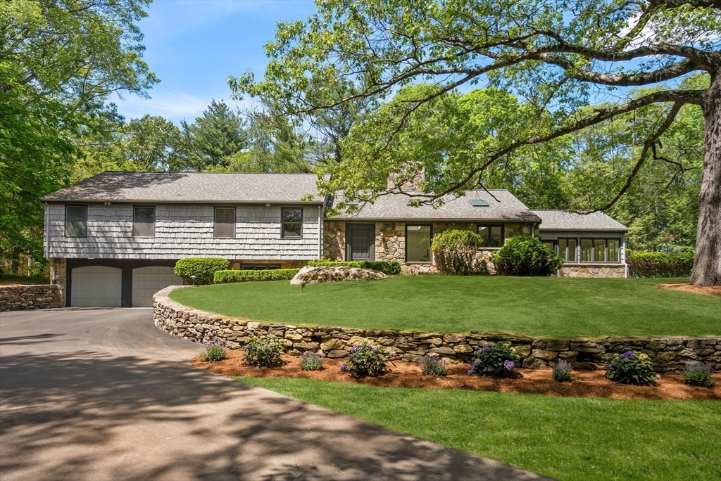 169 Hickory Road Weston, MA 02493 - Photo 2 of 30 a front view of a house with a garden