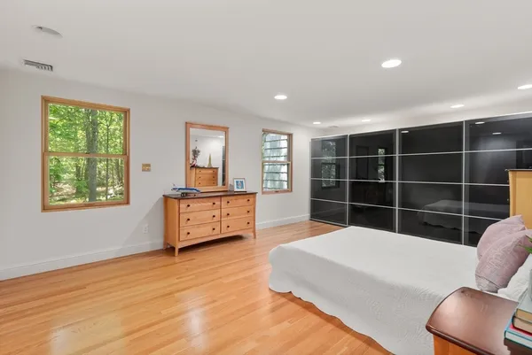 a bedroom with furniture and window