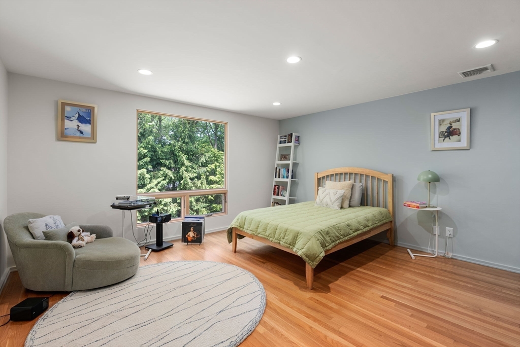 169 Hickory Road Weston, MA 02493 - Photo 22 of 30 a bedroom with a bed and a large window