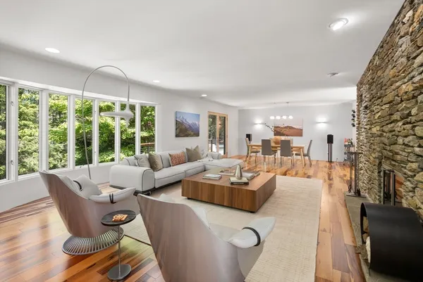 a living room with furniture and a large window