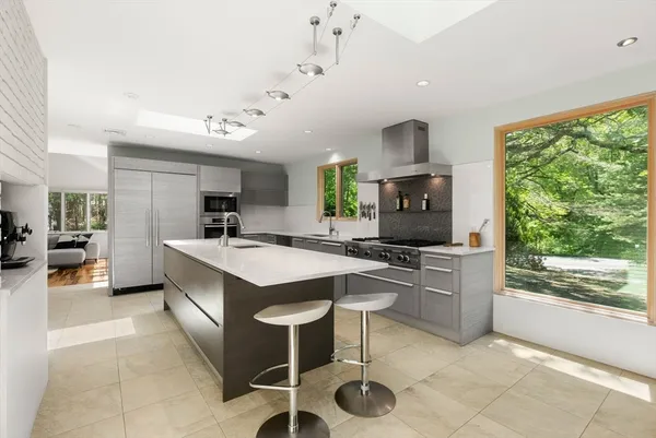 a kitchen with a stove a refrigerator and a sink