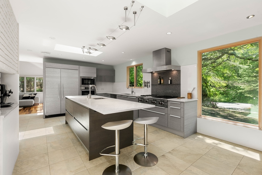 169 Hickory Road Weston, MA 02493 - Photo 9 of 30 a kitchen with a stove a refrigerator and a sink