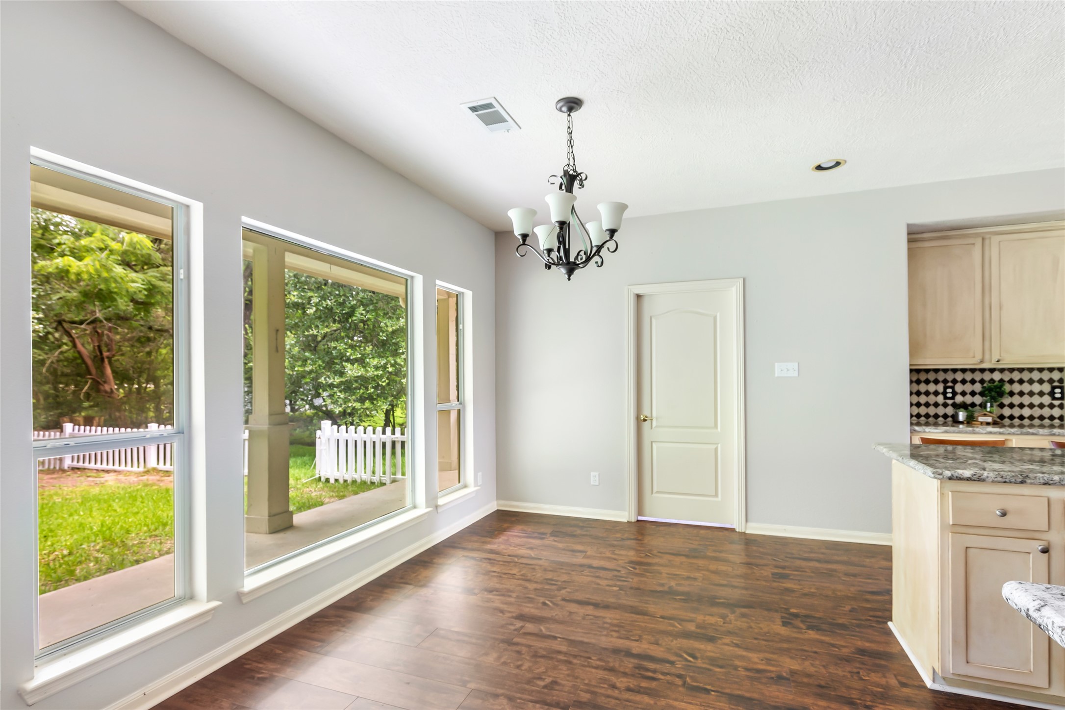 123 Burwell Road Highlands, TX 77562 - Photo 9 of 25 Large windows bring the outside in to this lovely breakfast area