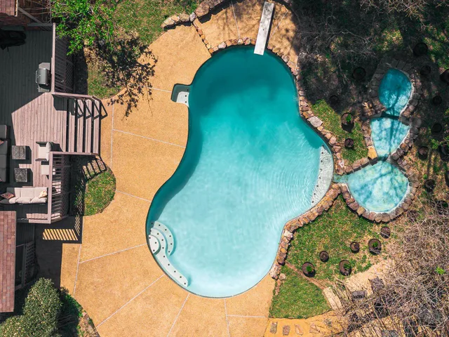 a view of outdoor space yard swimming pool and green space