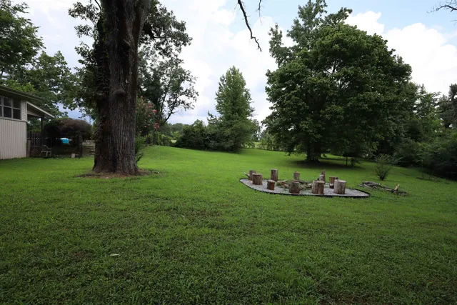 a white bath tub sitting next to a toilet