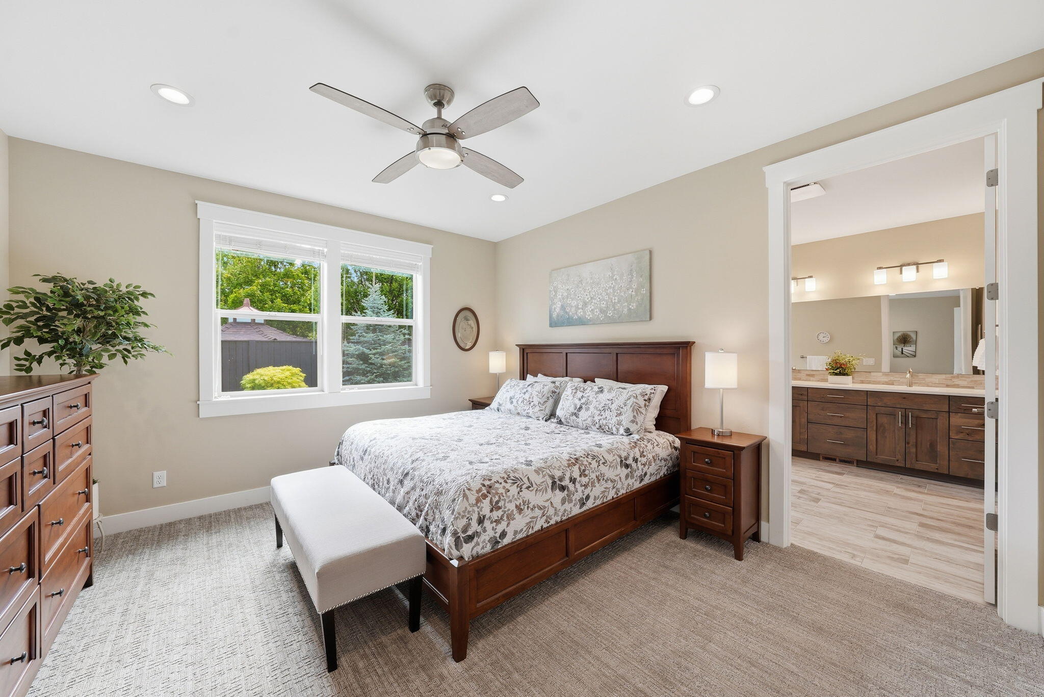 2714 Northwest 23rd Street Redmond, OR 97756 - Photo 19 of 57 a bedroom with a large bed and a chandelier