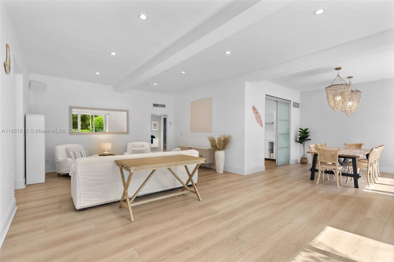 200 Ocean Ln Drive, Unit 108 Key Biscayne, FL 33149 - Photo 2 of 39 a living room with furniture and a wooden floor