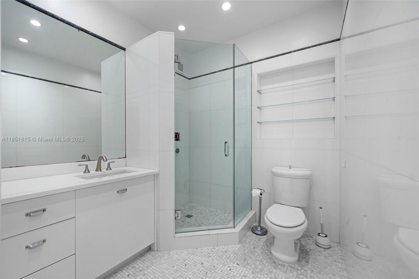 200 Ocean Ln Drive, Unit 108 Key Biscayne, FL 33149 - Photo 23 of 39 a bathroom with a toilet sink and shower