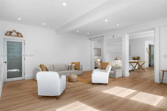 a living room with furniture and white walls