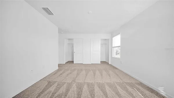 a view of an empty room and window
