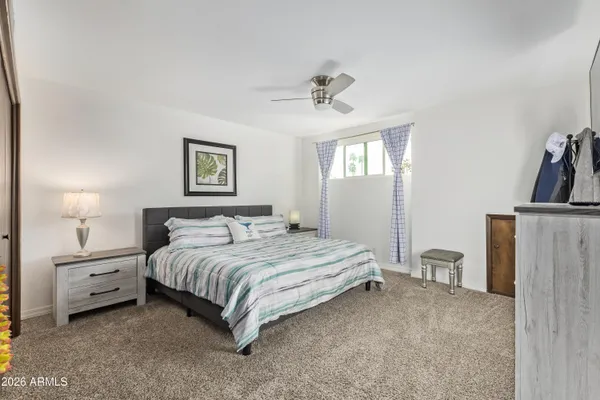 a living room with lots of furniture and black walls