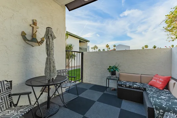 a picture of a bench in front of a wall