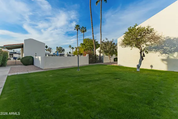 a kitchen with stainless steel appliances granite countertop a sink and cabinets