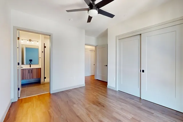 a view of livingroom with hardwood floor and a ceiling fan