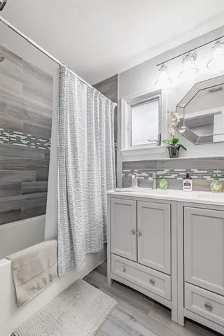 a view of a kitchen with sink and window