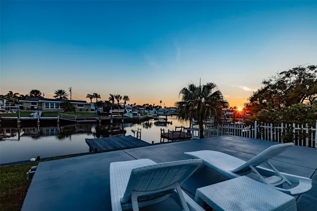 a terrace with outdoor seating and city view