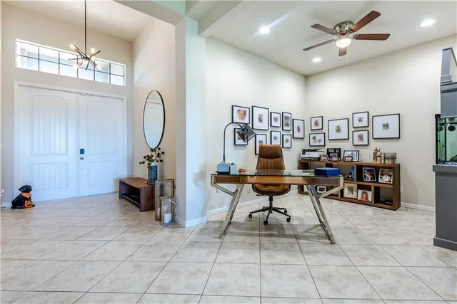 a work room with furniture and a bookshelf