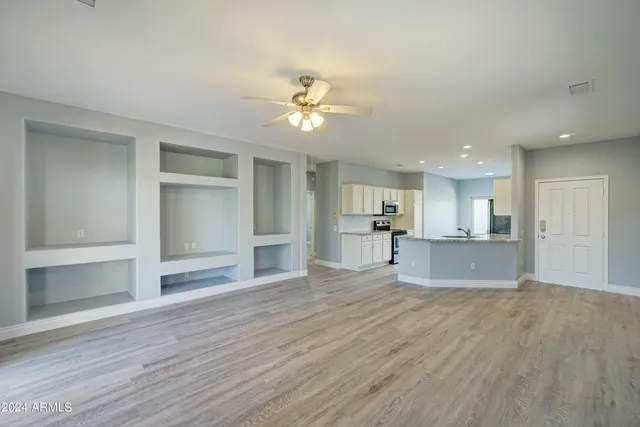 a view of kitchen with wooden floor and a kitchen