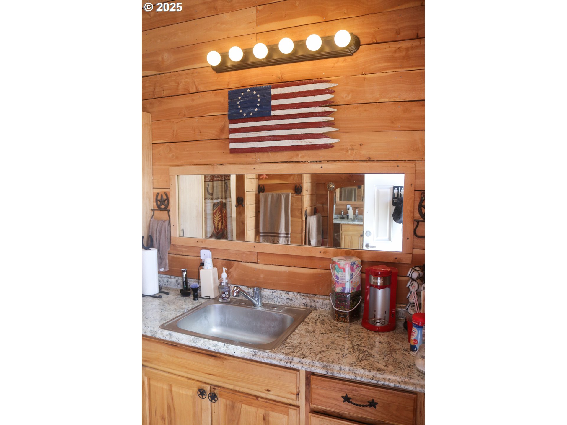 66410 Crane-Buchanan Road Burns, OR 97720 - Photo 13 of 37 a view of a bathroom with a sink and mirror