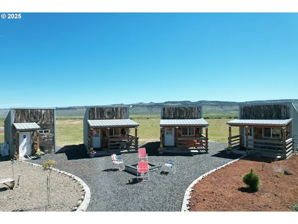 a kitchen with stainless steel appliances kitchen island granite countertop a refrigerator and a sink