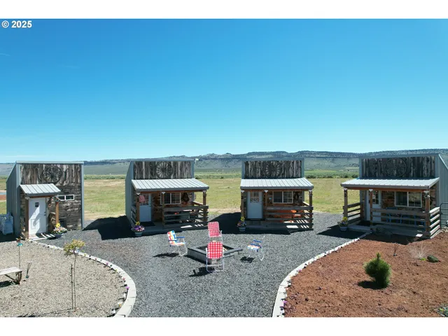 a kitchen with stainless steel appliances kitchen island granite countertop a refrigerator and a sink