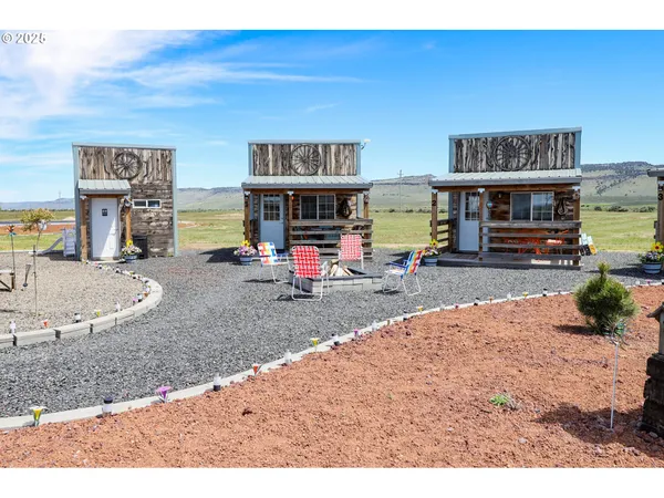 a view of front door of house with stairs