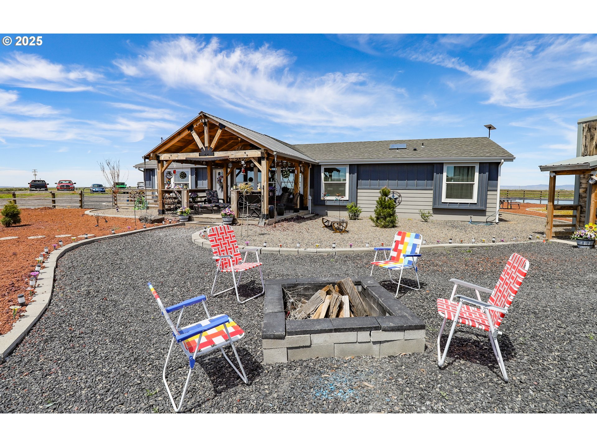 66410 Crane-Buchanan Road Burns, OR 97720 - Photo 24 of 37 a backyard of a house with table and chairs