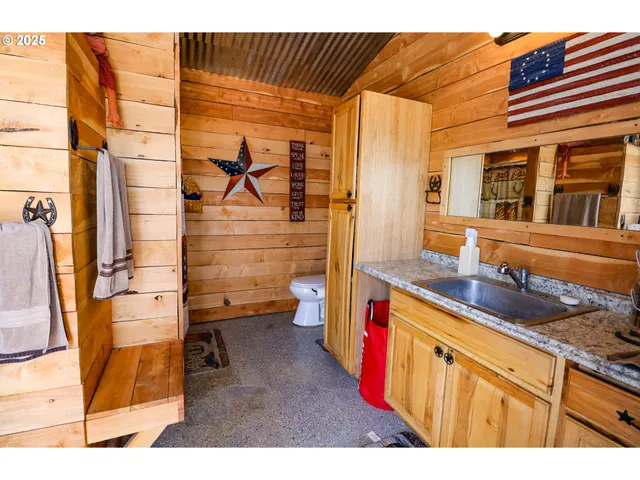 a bedroom with double bed and a chandelier