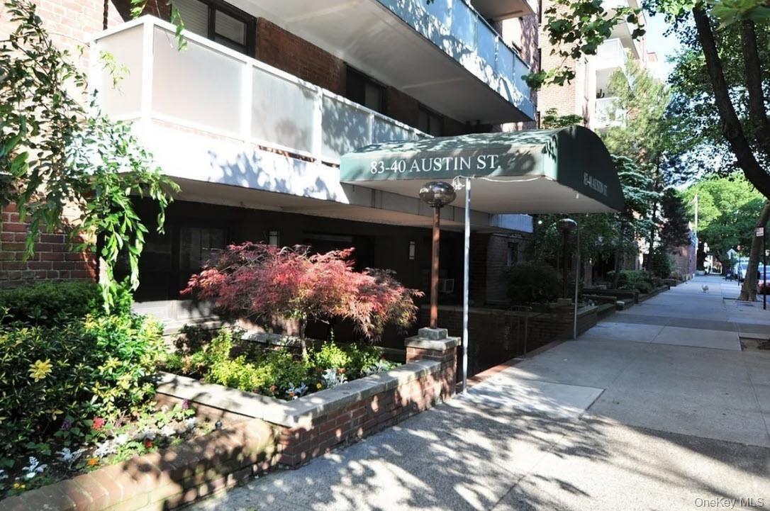 83-40 Austin Street, Unit 3U Queens, NY 11415 - Photo 7 of 8 a view of a chairs and flower in a yard