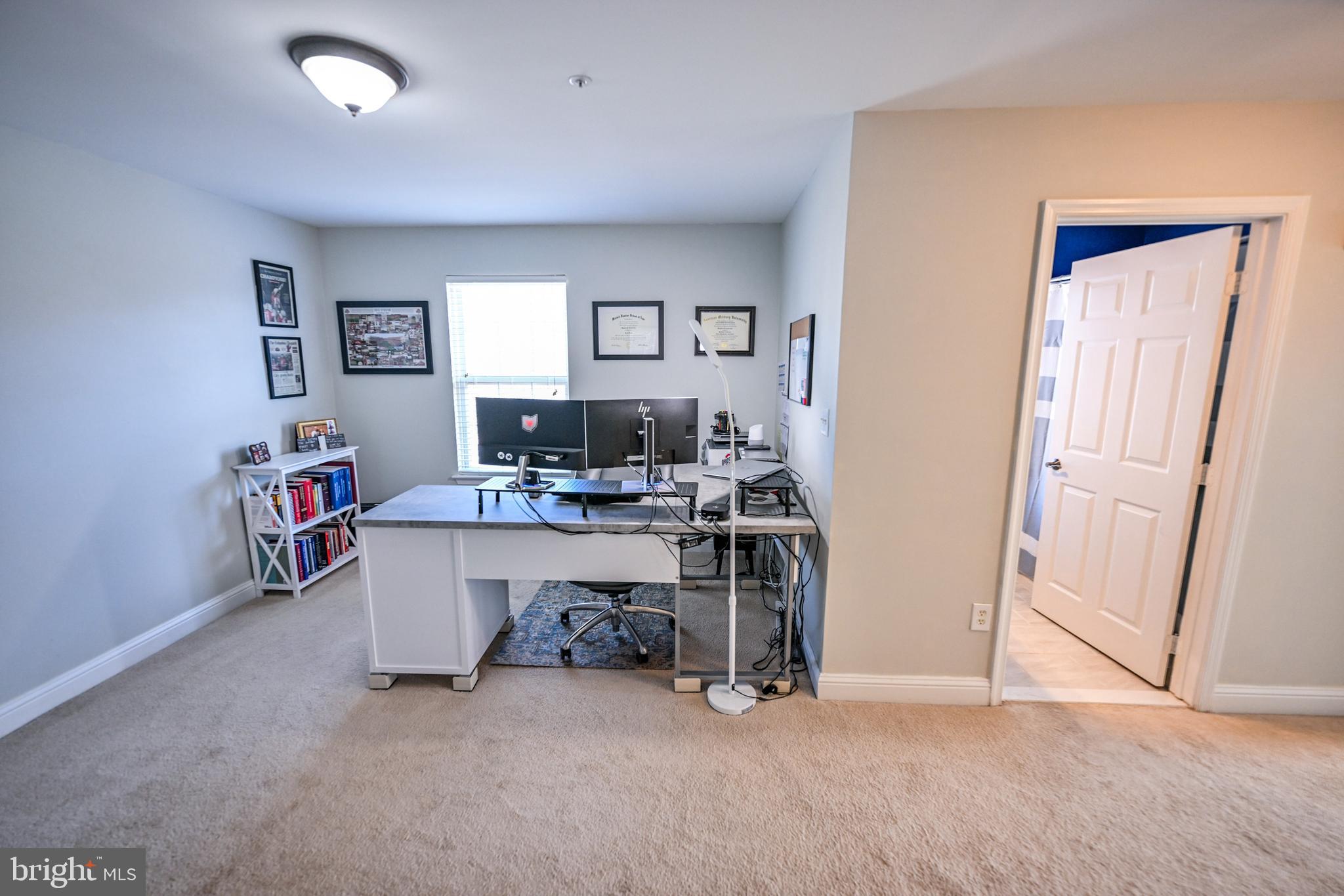 8727 Grape Arbor Way Odenton, MD 21113 - Photo 21 of 49 a view of a workspace with furniture and a window