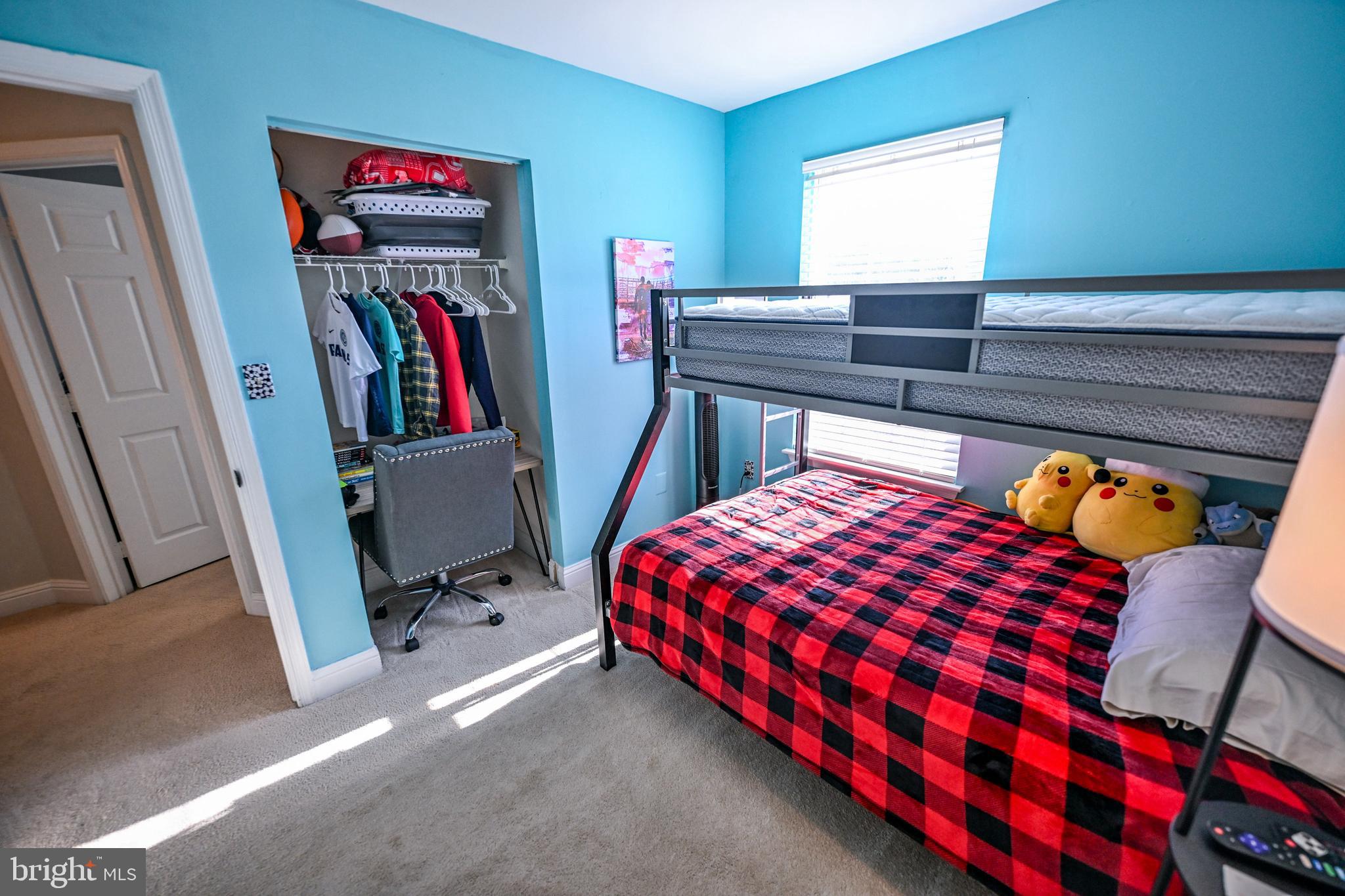 8727 Grape Arbor Way Odenton, MD 21113 - Photo 26 of 49 a bedroom with a bed and a book shelf