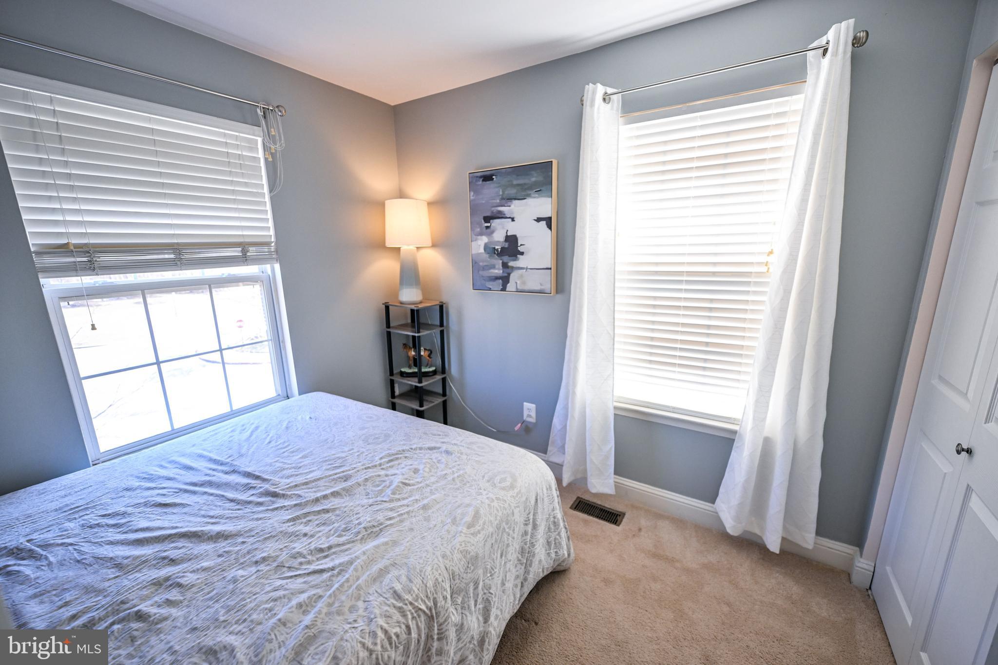 8727 Grape Arbor Way Odenton, MD 21113 - Photo 30 of 49 a bedroom with a bed and a window