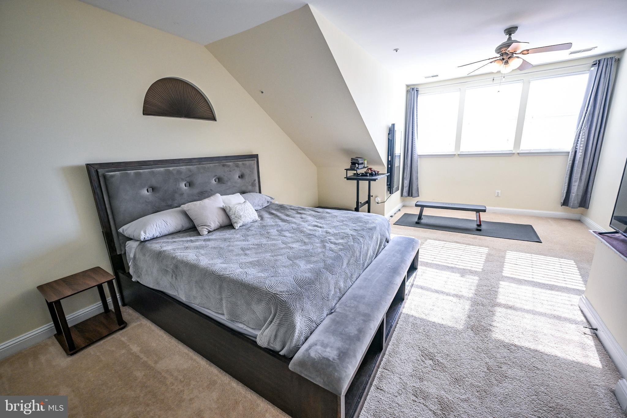 8727 Grape Arbor Way Odenton, MD 21113 - Photo 33 of 49 a bedroom with a large bed and a window