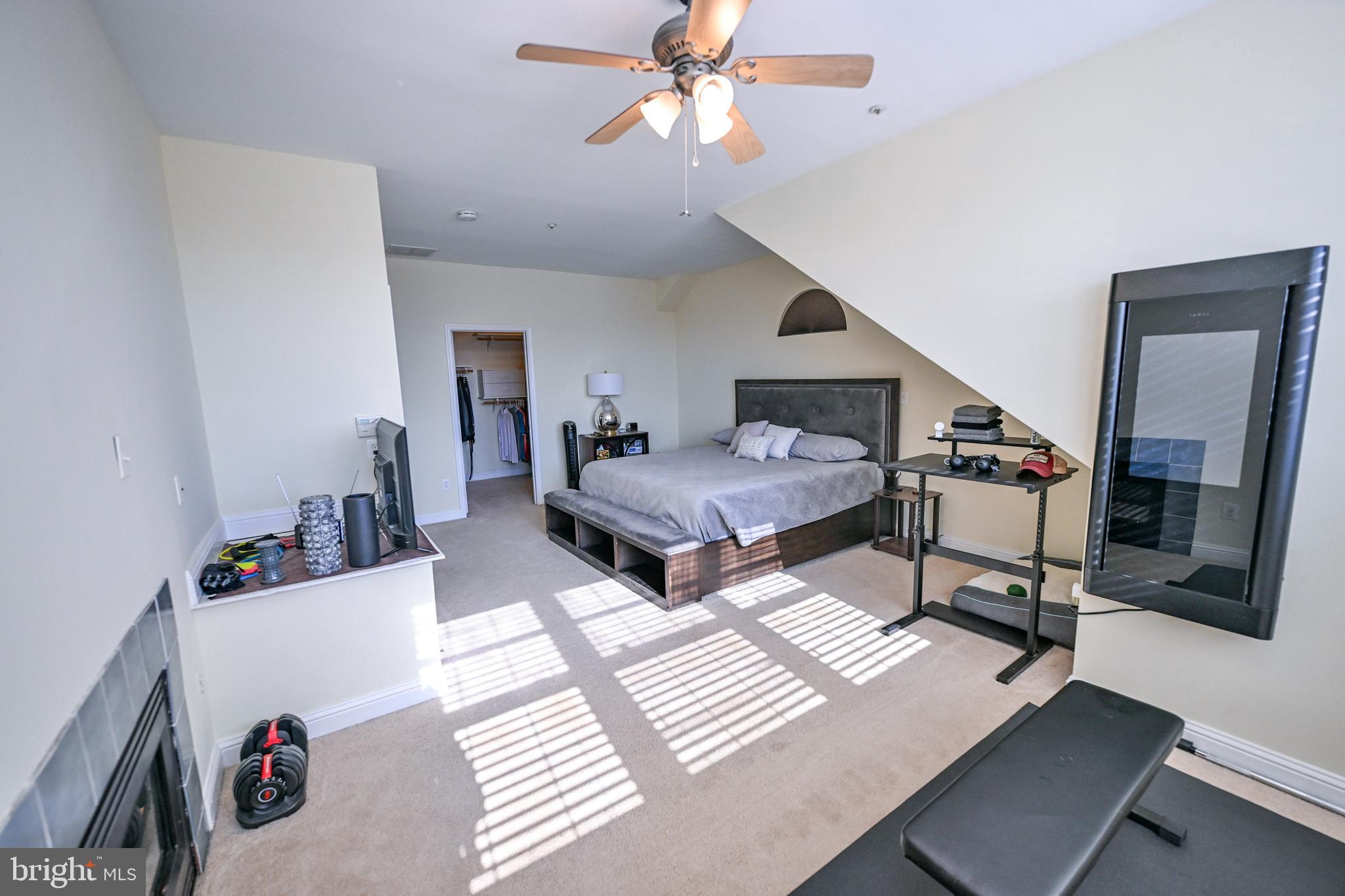 8727 Grape Arbor Way Odenton, MD 21113 - Photo 36 of 49 a bedroom with furniture and a chandelier