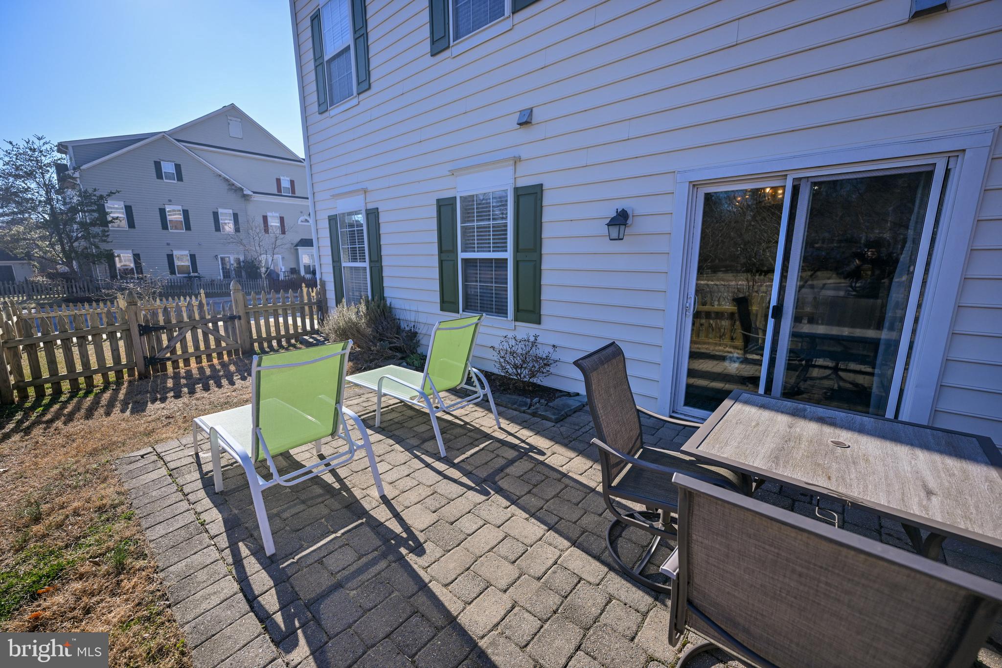 8727 Grape Arbor Way Odenton, MD 21113 - Photo 43 of 49 a view of house with a chairs and table in a patio
