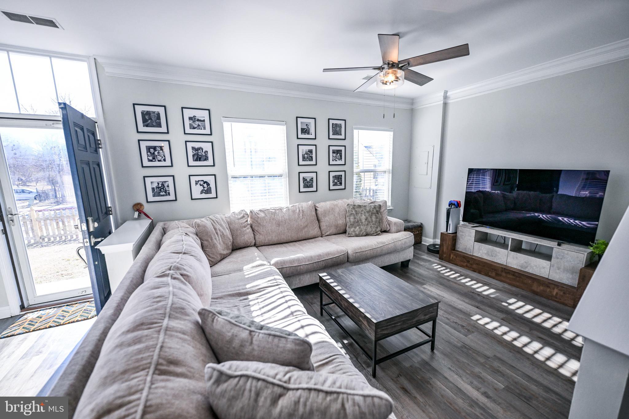 8727 Grape Arbor Way Odenton, MD 21113 - Photo 5 of 49 a living room with furniture and a flat screen tv