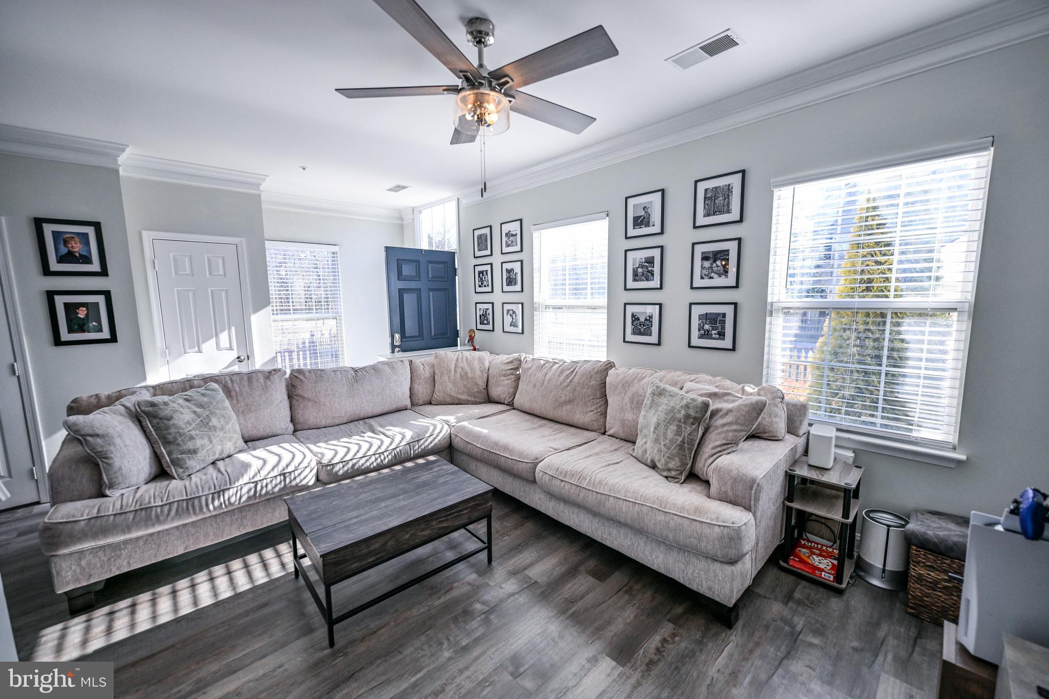 8727 Grape Arbor Way Odenton, MD 21113 - Photo 6 of 49 a living room with furniture and a large window