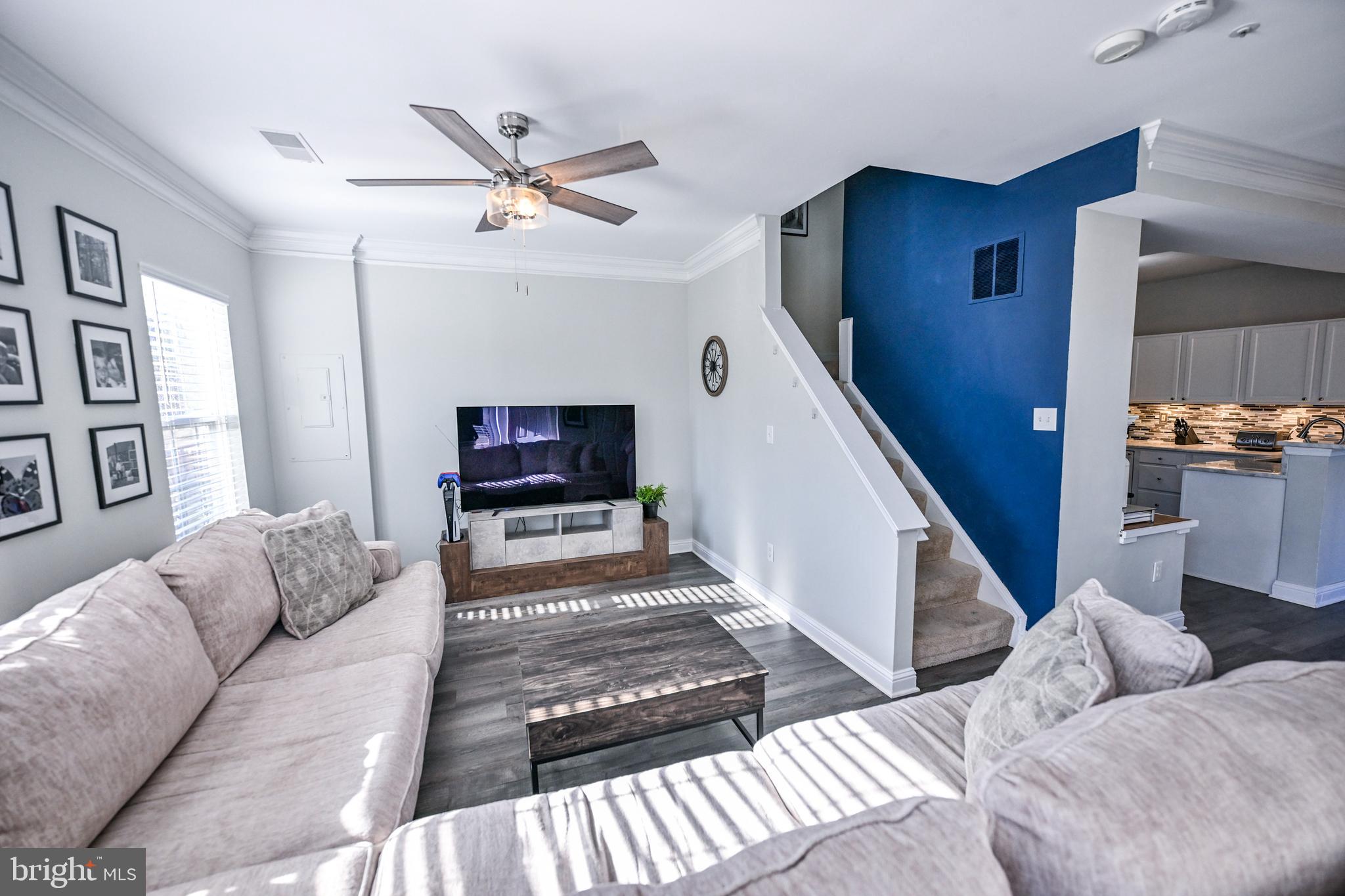 8727 Grape Arbor Way Odenton, MD 21113 - Photo 8 of 49 a living room with furniture and a wooden floor