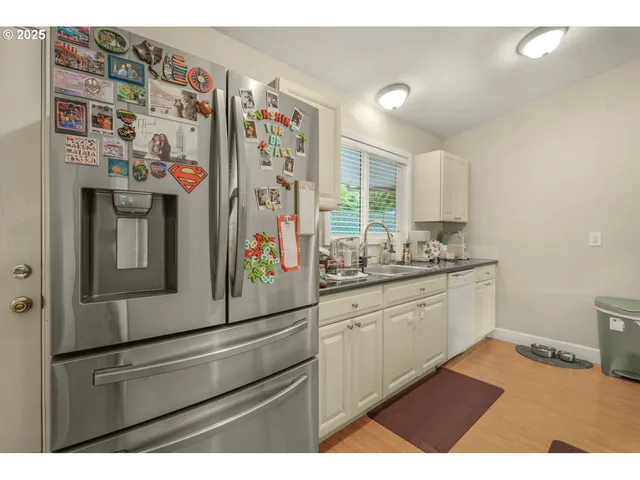 a kitchen with refrigerator and window