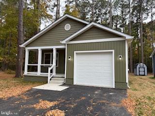 58 South Glebe Road Montross, VA 22520 - Photo 20 of 25 a front view of a house with a yard and garage