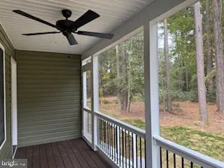 a view of a porch with wooden floor and outdoor space