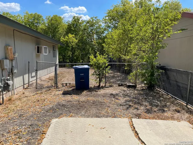 a backyard of a house with seating space